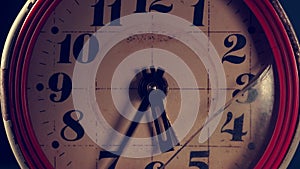 Old broken rusty clock. The hands of the clock are moving fast. close-up.