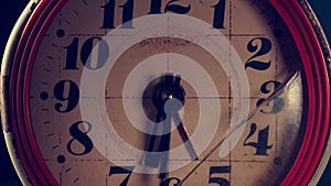 Old broken rusty clock. The hands of the clock are moving fast. close-up.