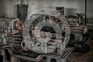 Old broken rusty lathes in the workshop