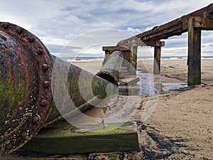 Old broken sewage pip at Cambois beach, Northumberland, UK