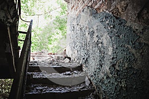 Old broken staircase in rusty ruined abandoned house