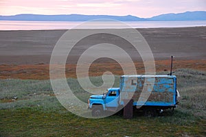 Old broken truck adapted as shed at tundra island photo