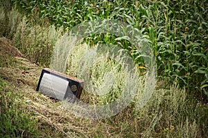 Old broken TV in the field