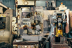 Old broken unused machine rusty steel in factory machinery workshop