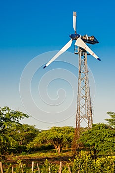 Old broken windmill at sunset