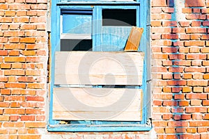 Old broken window on the wall