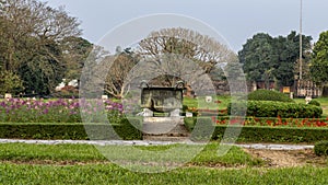 Old bronze cauldron in the garden of the Forbidden city , Imperial City inside the Citadel, Hue, Vietnam