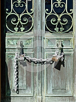 Old Bronze Doors Secured With Lock and Chain