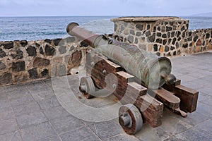 Old bronze spanish naval cannon in a port of Puerto de la Cruz