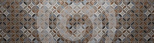 Old brown beige vintage shabby patchwork mosaic motif tiles stone concrete cement wall texture background with circle print