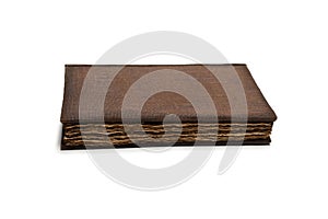 An old brown book isolated on white background