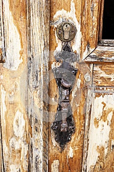Old brown chipped wooden door