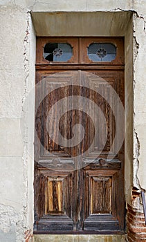 Old brown door of a morbid house