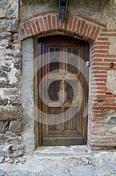 Old brown door of a morbid house