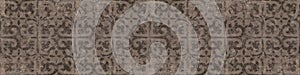 Old brown gray rusty vintage worn shabby elegant floral leaves flower patchwork motif tiles stone concrete cement wall wallpaper