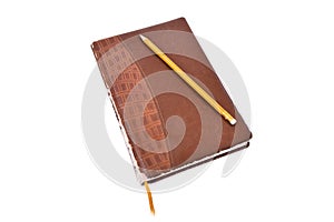 Old brown leather diary on a white background