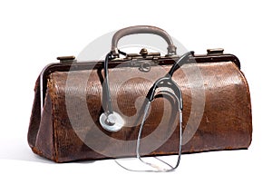 Old brown leather doctors bag and stethoscope