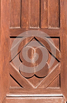 Old brown natural wooden door with a pattern