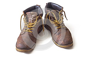 Old brown nubuck boots with yellow laces