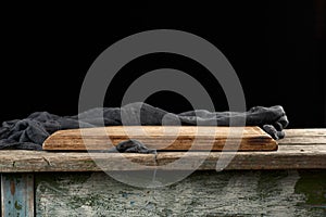 Old brown rectangular wooden kitchen cutting board