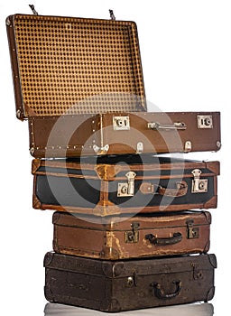 Old brown suitcases on white background