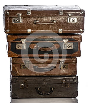 Old brown suitcases on white background