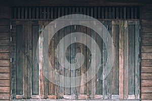 Old brown vintage window on wooden wall of Residential, home