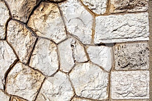 Old brown wall with stone masonry, background, texture