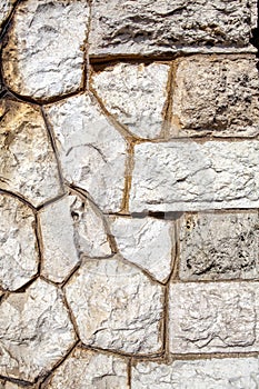 Old brown wall with stone masonry, background, texture
