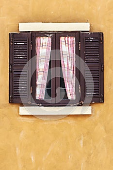 Old Brown Window with Curtain on Yellow Wall, Copy Space