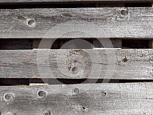 Old brown wooden background made of grey natural wood. Natural raw strocing wood texture. The boards do not lie evenly. Copy space