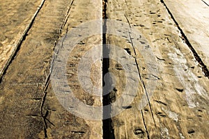 Old brown wooden table with aged marks