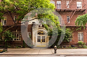 Old brownstone apartment building in Manhattan, New york city.