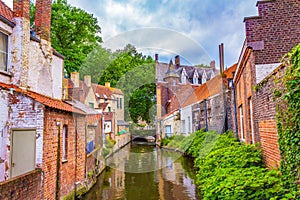 Old Bruges city canal view at cloudy summer day Belgium