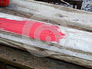 Old brushes in the paint process of painting an old board