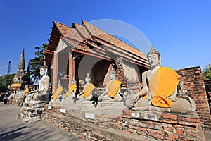 Old Buddha statue around the royal Pagoda in Wat Yai Chaimongkhon photo