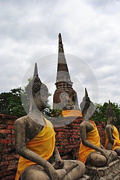 Old Buddha statues on cloud background