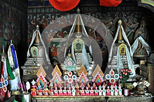 Old Buddhist altar with butter sculptures