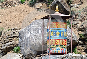 Old buddhist mani stones prayer wheels with sacred mantras on the way to Everest Base Camp, Nepal,Asia,Himalaya photo