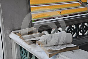 Old Buddhist paper pray handbook on tempel terrace