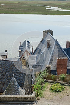 Old buidings and roofs in the town of le mont saint michel of france photo
