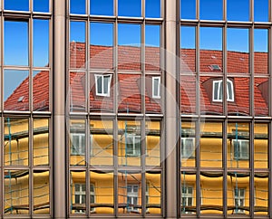 Old building architecture reflected in modern building