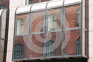 Old building architecture reflected in modern building