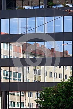 Old building architecture reflected in modern building