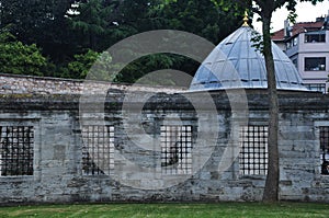 An old building behind a fence.