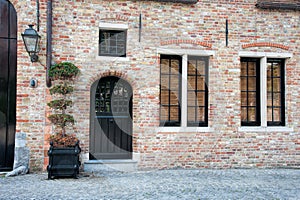 Old Building with Black Door and Windows