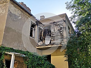 Old building with a burned out balcony after a fire