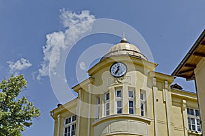 Old building with clock in mountain town Peshtera