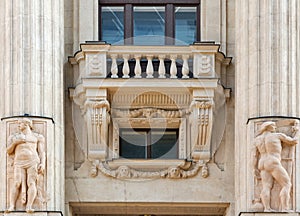 Old building exterior with balcony and columns in Budapest, Hungary.