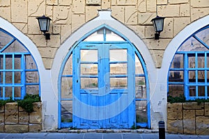 Old building facade with blue door and window